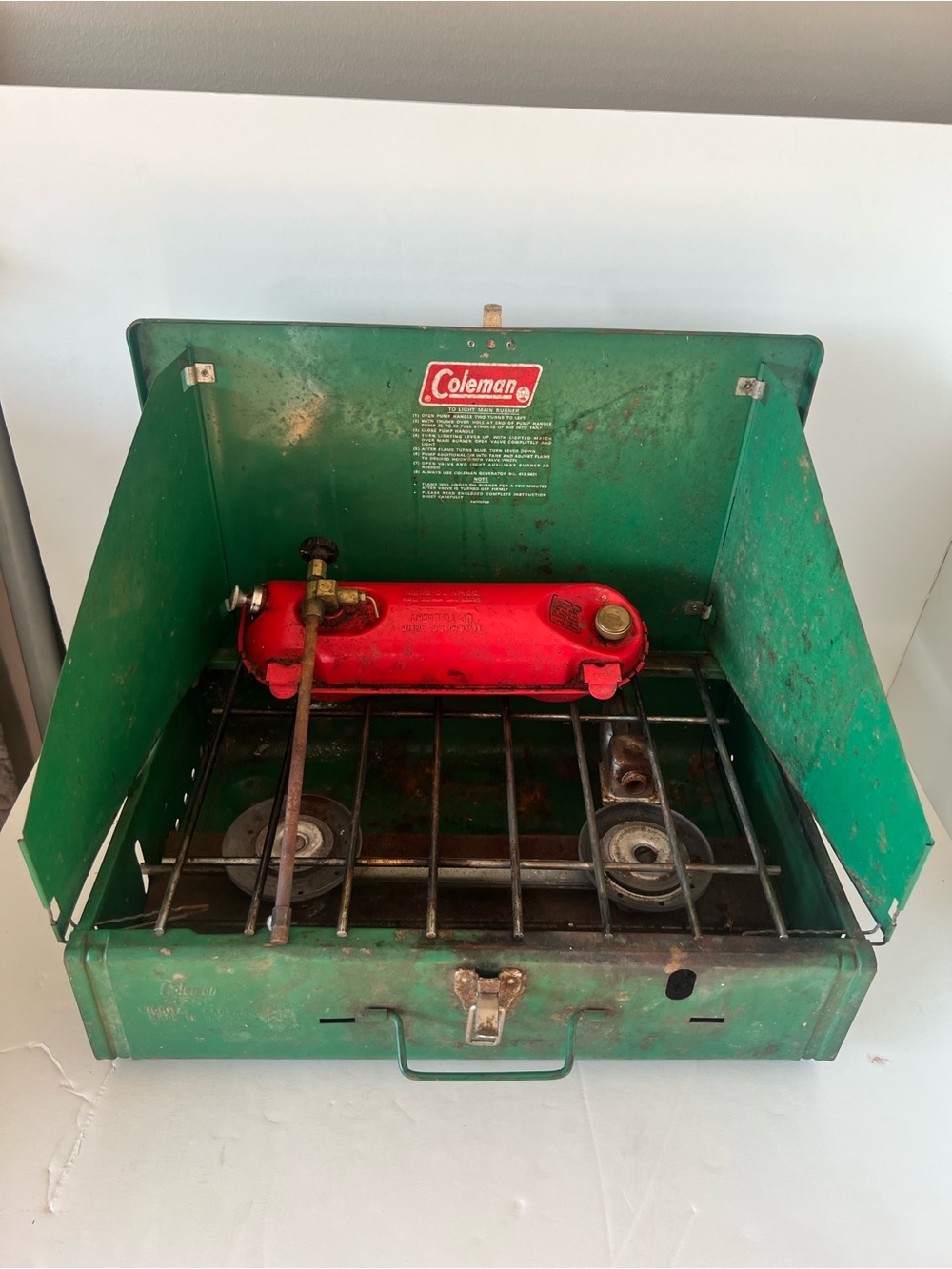 Coleman 425E Green Camp Stove with Red Fuel Tank